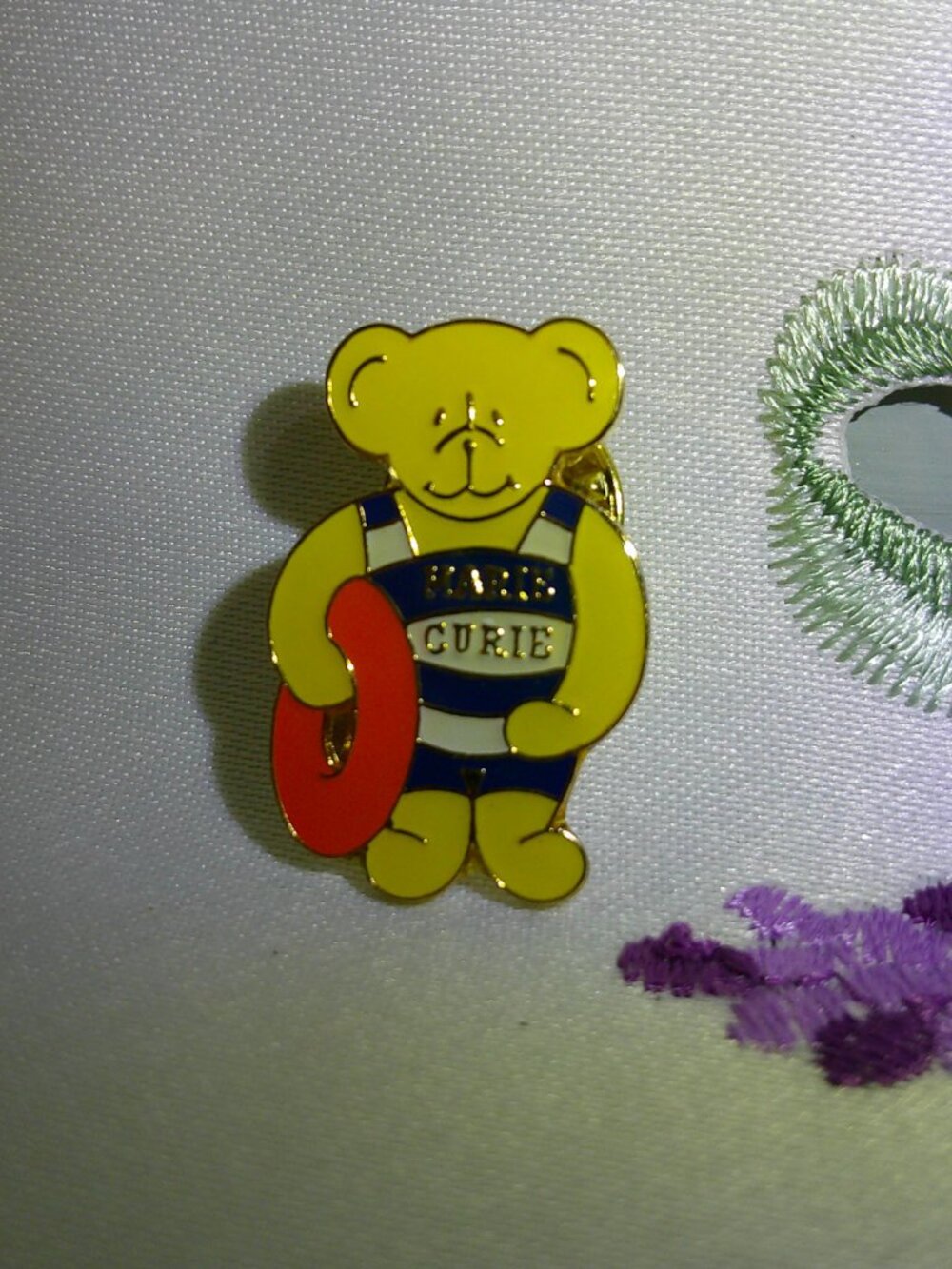 Vintage Marie Curie lapel pin Swimming Bear with Swim Ring
